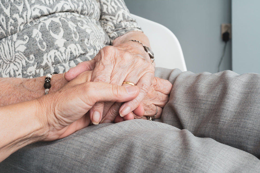 hands caregiving old age incontinence