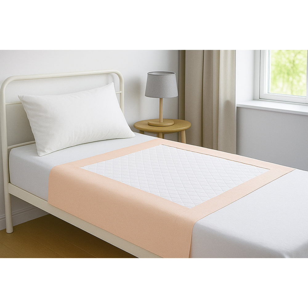 Bed in a room showing SPC Disposable Underpads with Tuck in Sides with peach borders that fits snug on a single bed